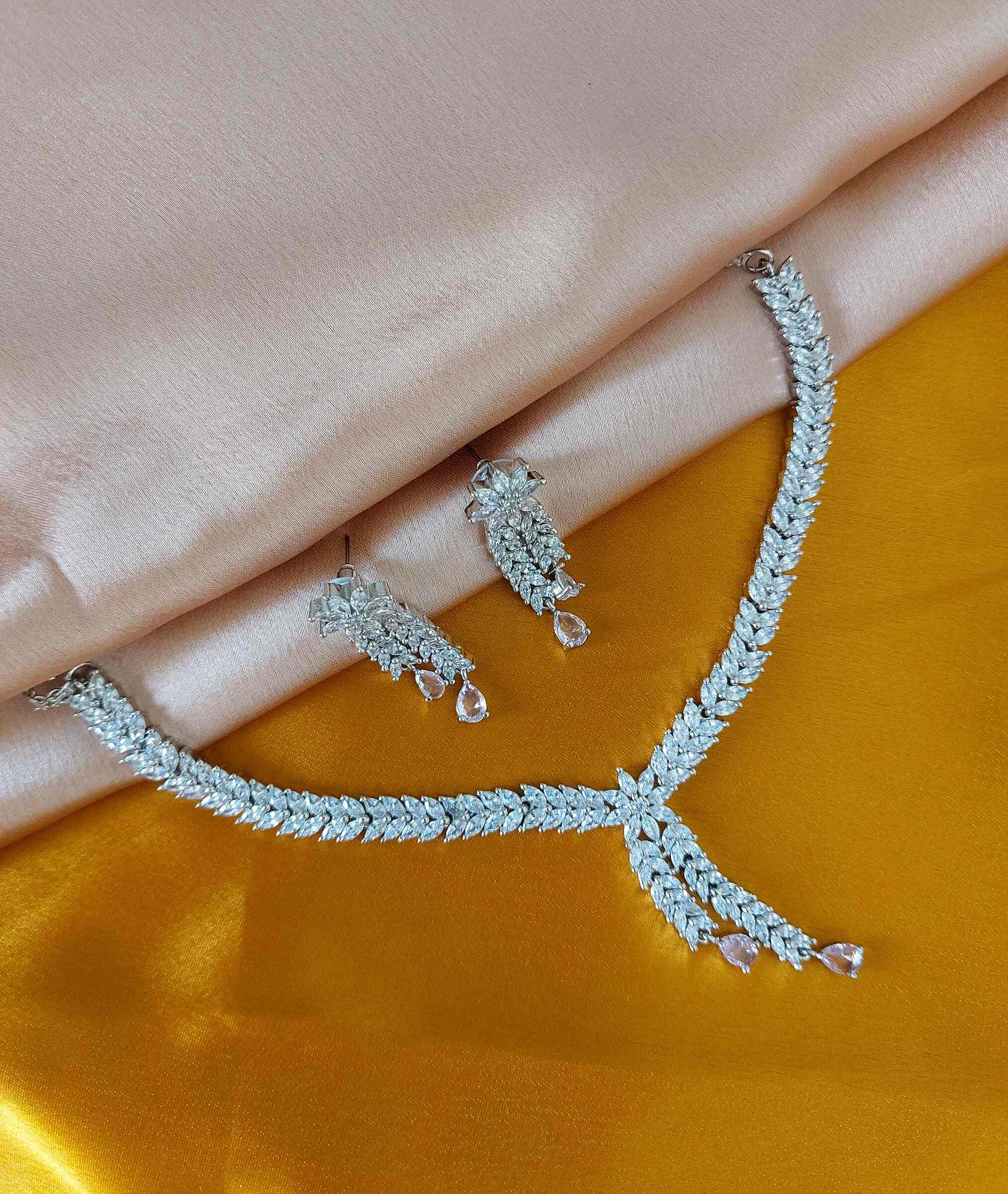 Charlotte Minimalistic Light Pink Coloured American Diamond Necklace Set With Earrings