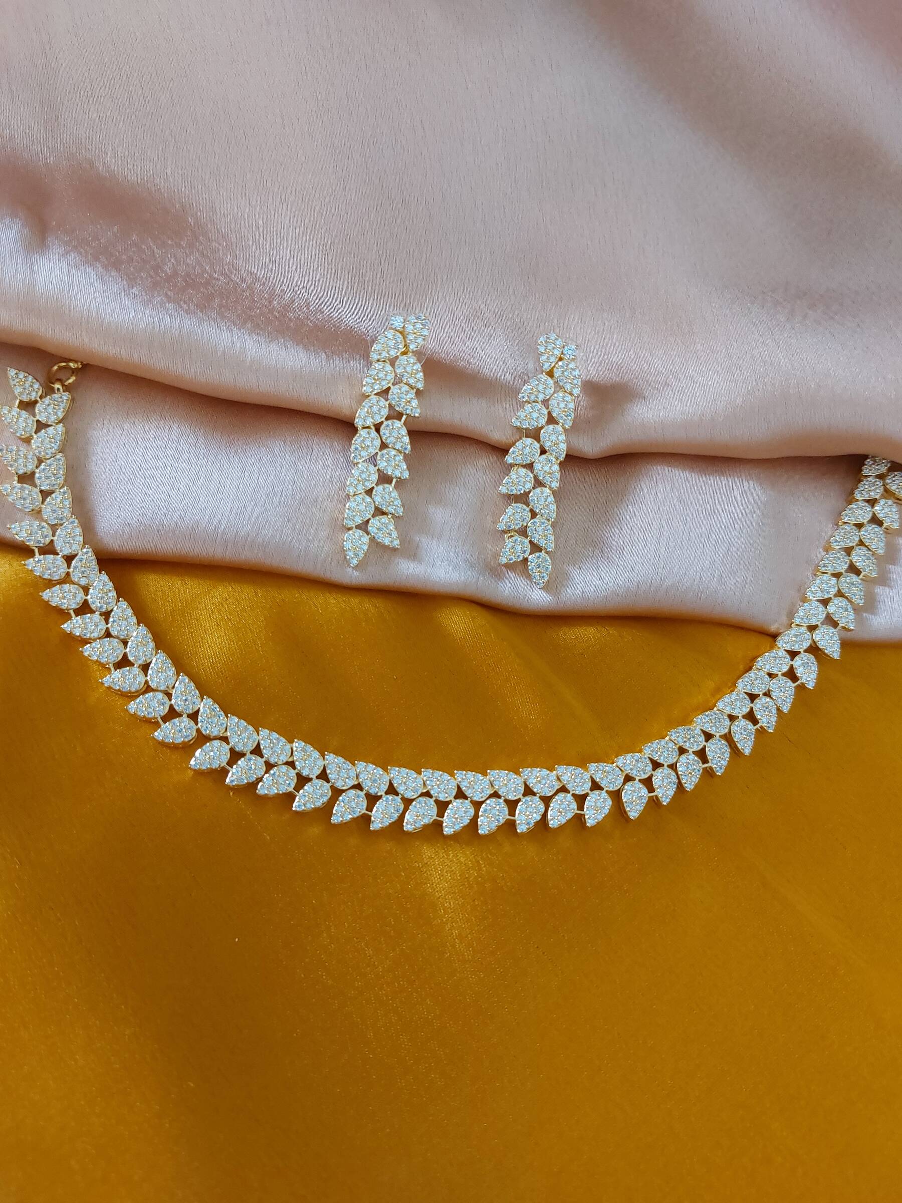 Ellie Royal Pan Shaped Gold Plated American Diamond Necklace Set With Earrings