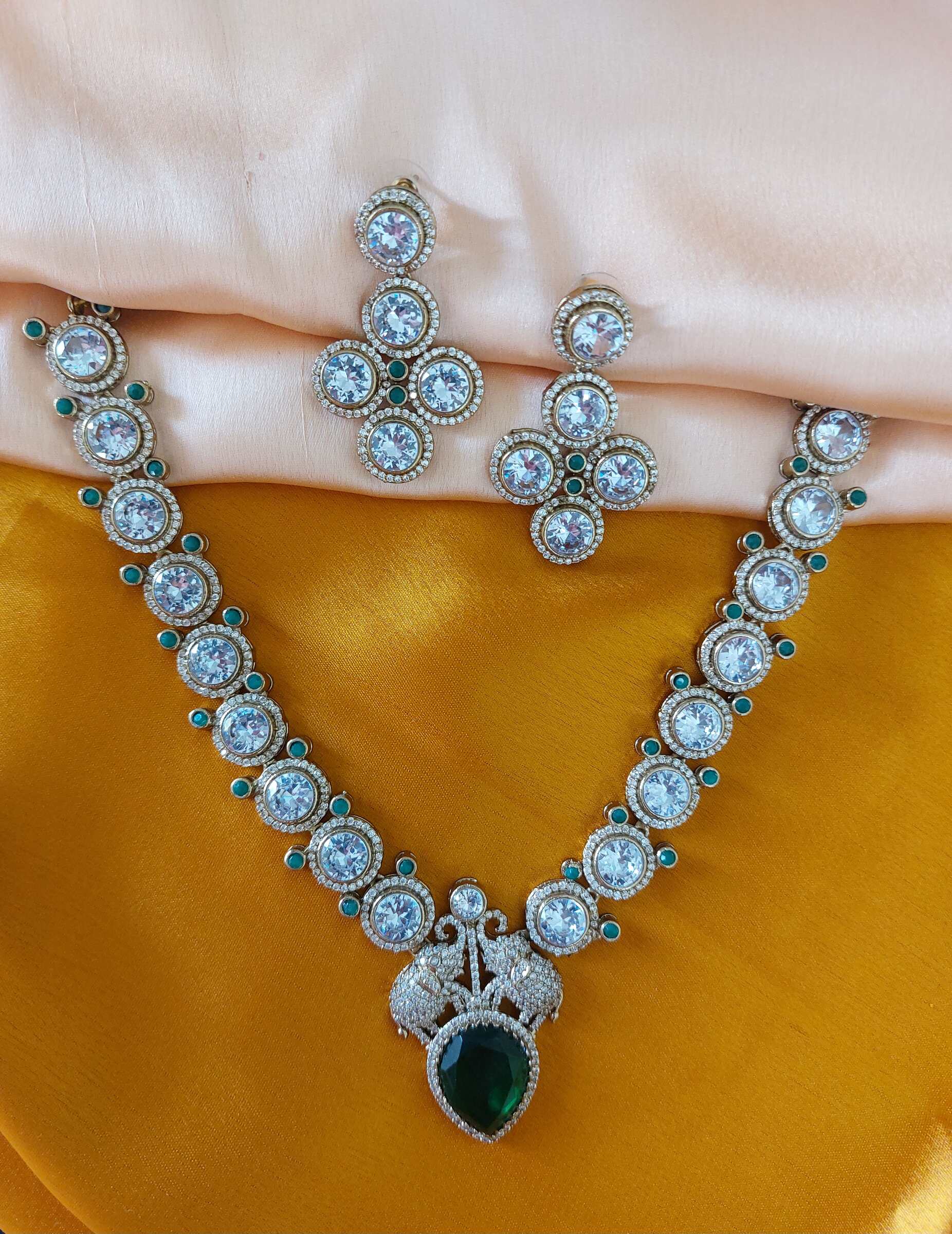 Maithili Moissanite AD Studded Elephant Embelished Green Coloured Necklace Set With Earrings