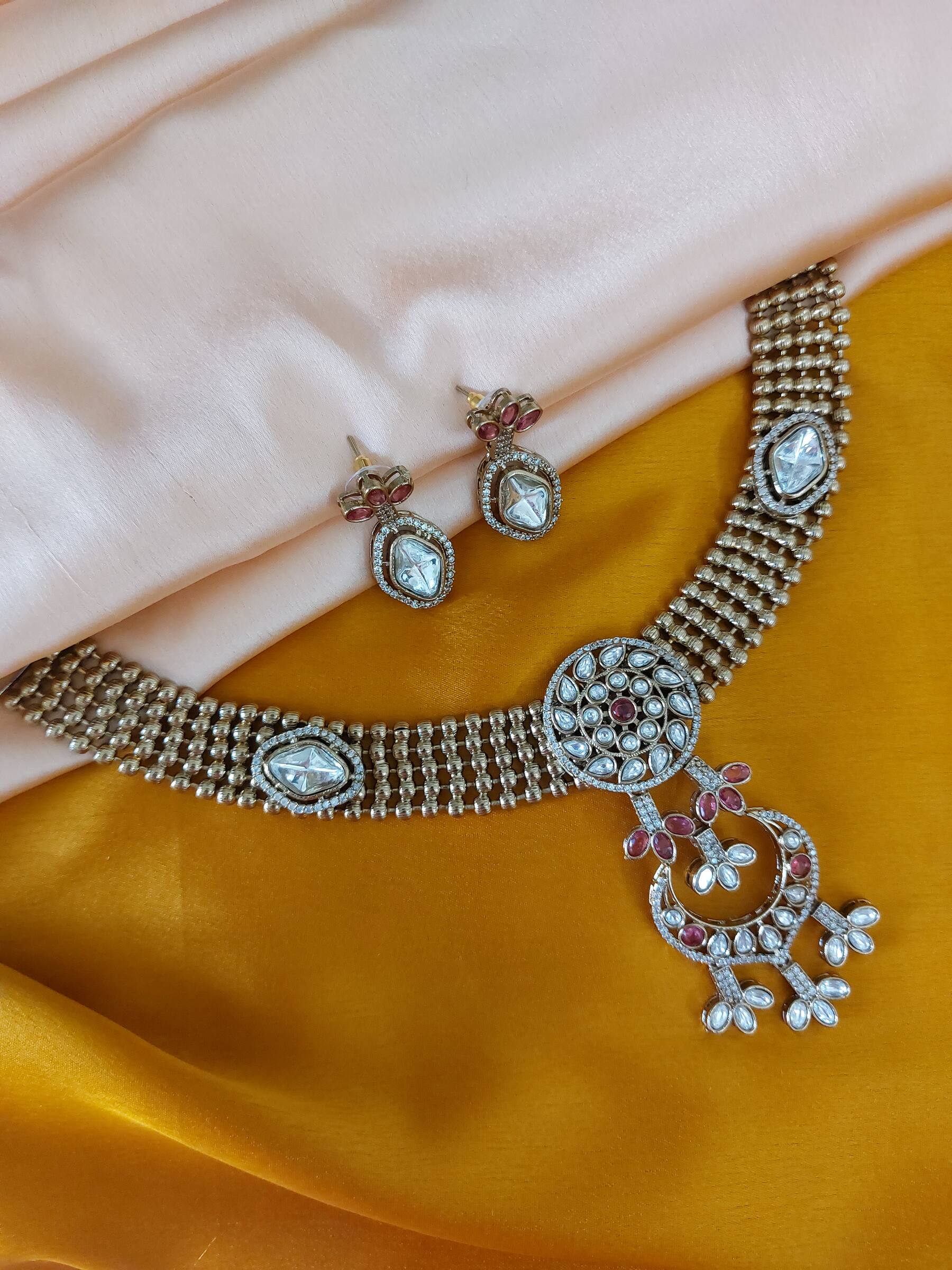 Manya Antique Gold Semi Bridal Celebrity Inspired Moissanite Ruby Coloured Kundan Necklace Set With Earrings